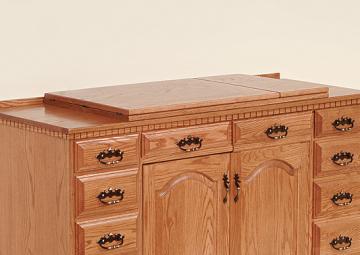 The optional support top is an additional panel of wood designed to provide a support to the wings. This feature is especially popular with larger sewing cabinet models. Support top